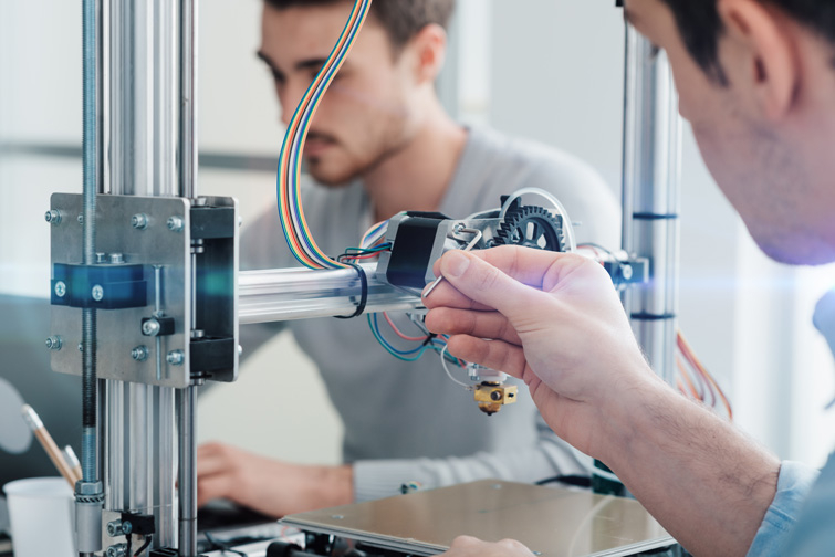 Engineering students working on a systems control project