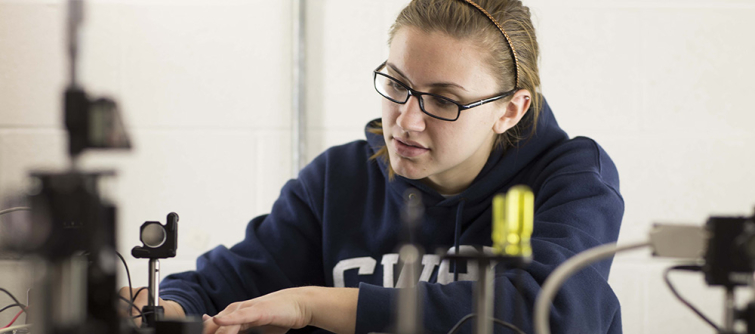 mechanical and aerospace engineering student working on laser table